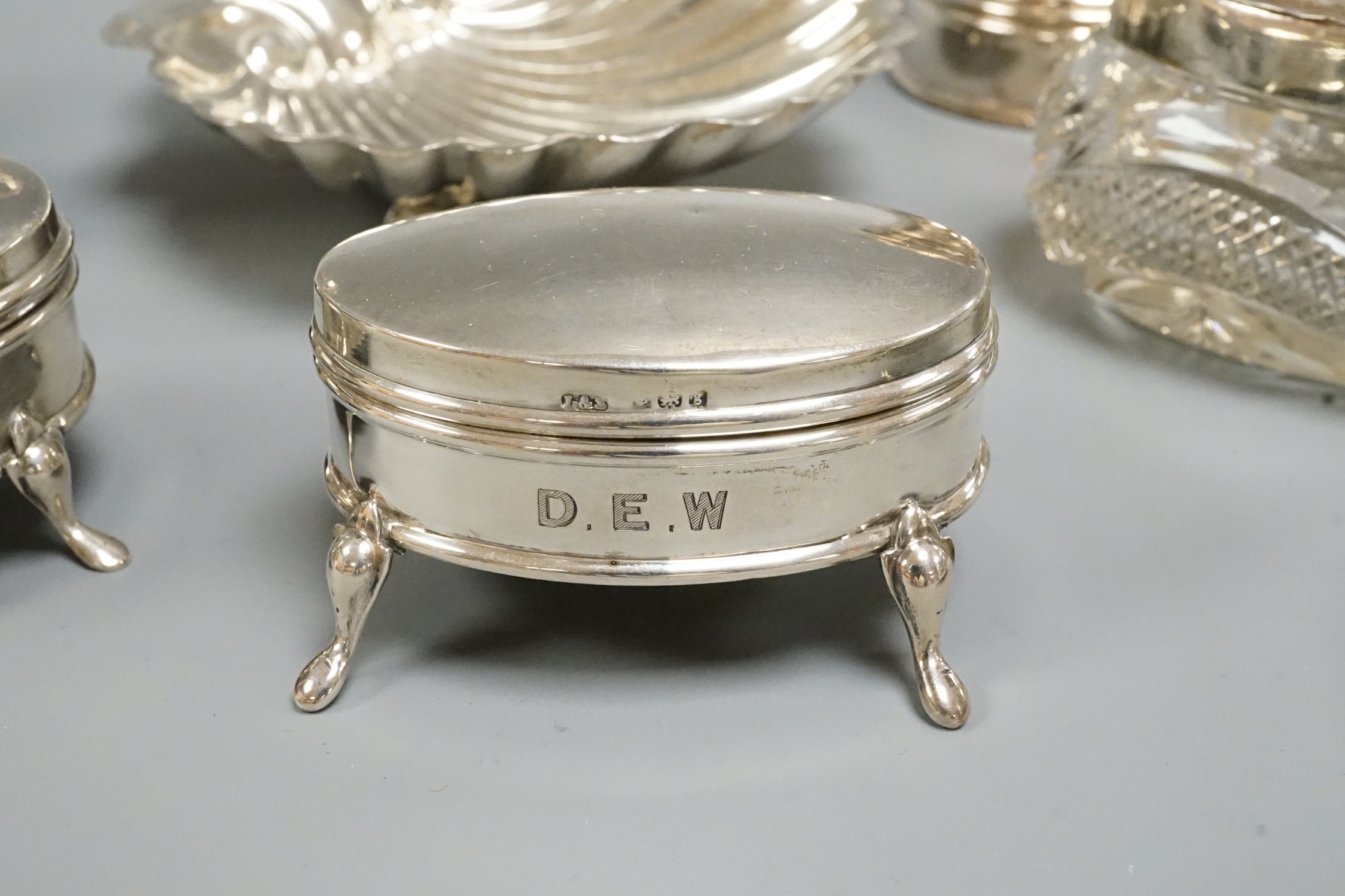 Sundry silver including cream and sugar, trinket boxes, butter shell, toilet jars, etc.